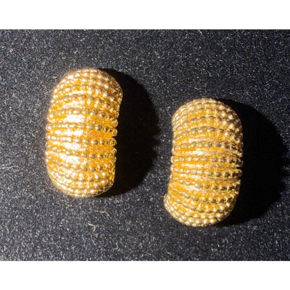 Vintage Trifari gold-tone half-hoop earrings, a textured, ridged style .75” long
